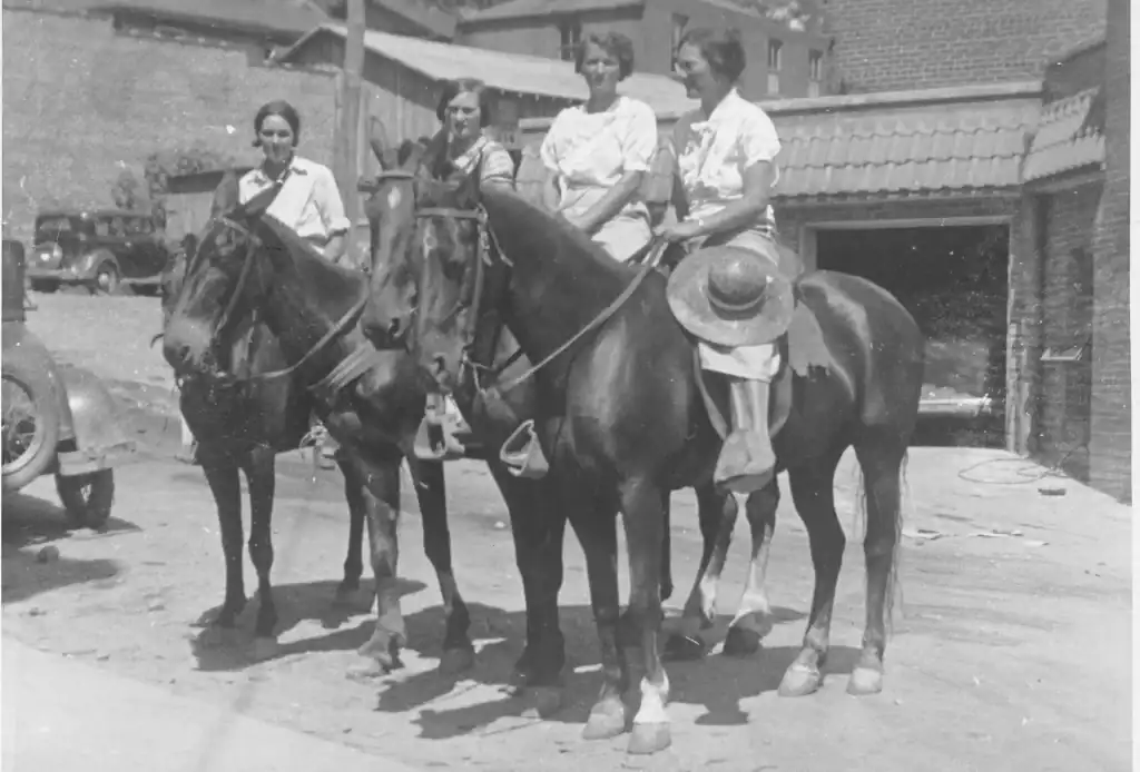 Four packhorse librarians on horseback in town during the 1930s.