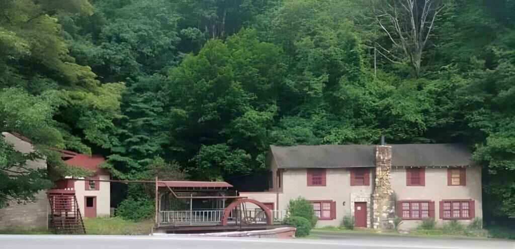 Blue Ridge Court and Restaurant near Fancy Gap Mountain with stone walls, red shutters, and a waterwheel.