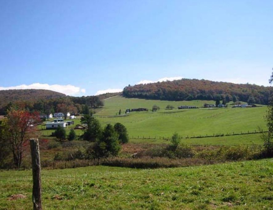 Pasture and farm buildings along the Parkway showing restored open fields.