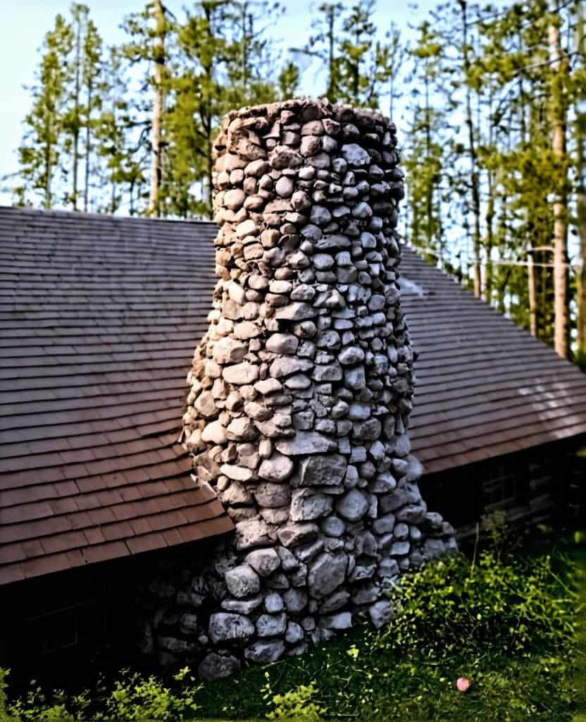 Fieldstone chimney on a mountain cabin showing how an Appalachian cabin chimney was built for permanence.