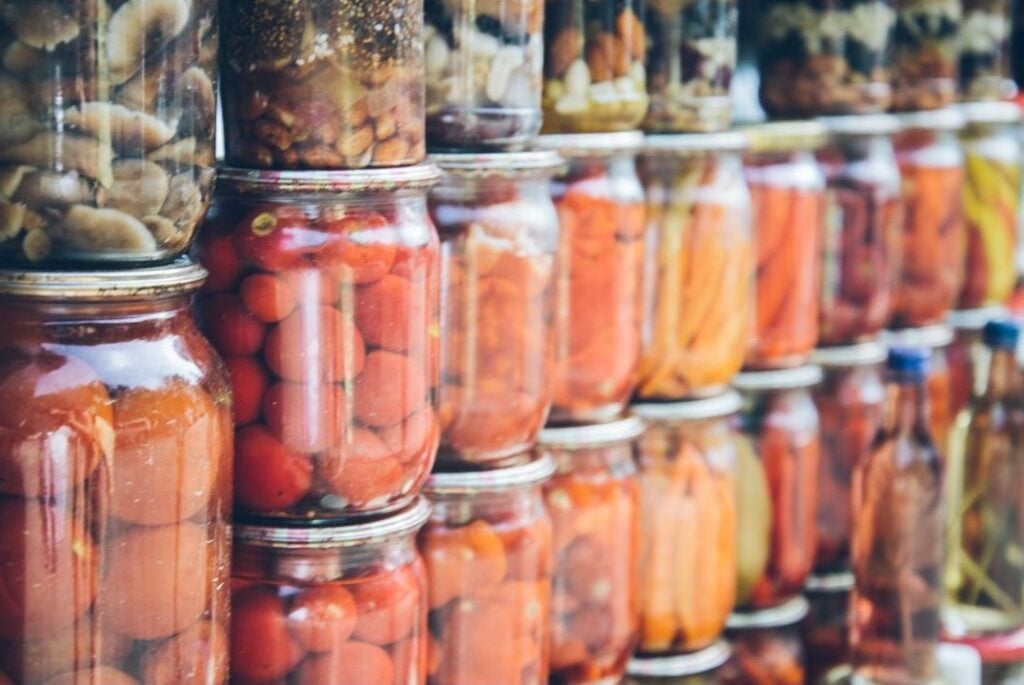 Shelves lined with jars of preserved vegetables and fruit represent a portion of Appalachian Foodways.