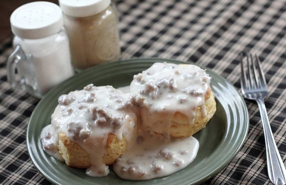 Biscuits and sausage gravy made from jar-canned sausage, a common use of canning sausage in Appalachian kitchens.
