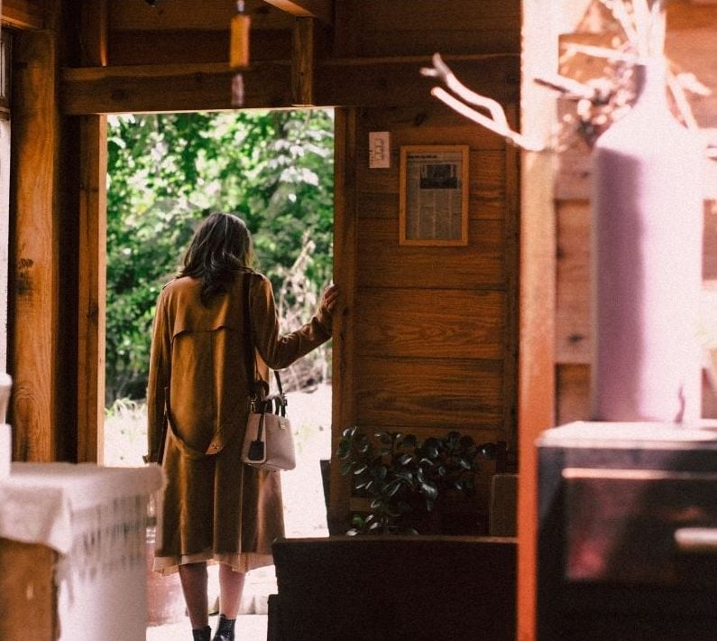 Interior cabin doorway showing daily movement central to Appalachian faith and folk practice