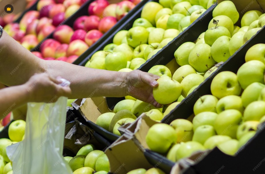 Selecting firm apples by hand to check texture and density