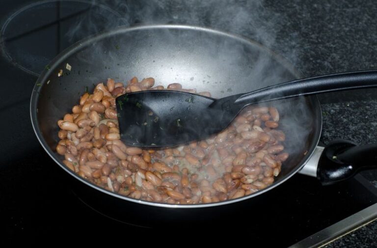 Cast iron pot filled with cooked beans, illustrating how Appalachian kitchen foraging added flavor to everyday meals.