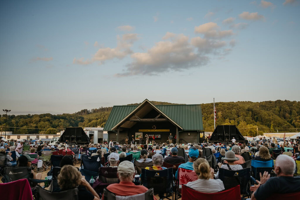 Appalachian fiddle tunes performed at the Galax Fiddlers Convention with musicians and audience gathered outdoors