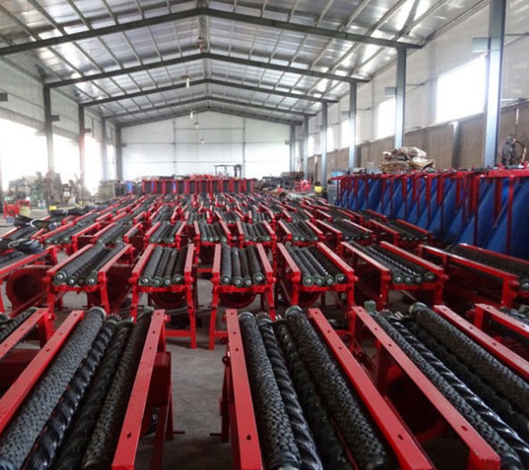Industrial corn husker machine used to remove husks mechanically from harvested corn