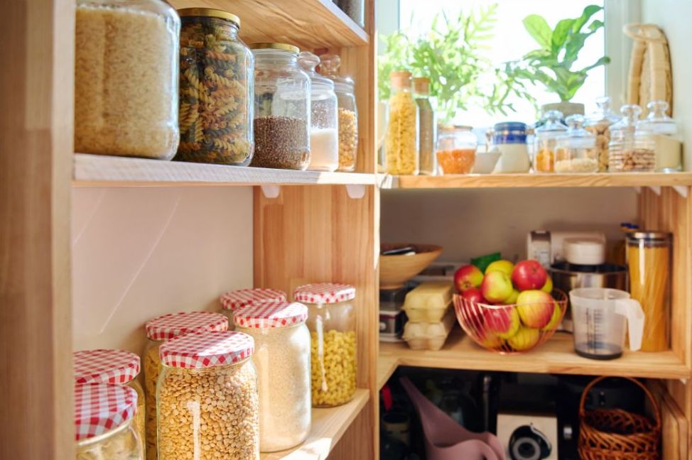 Jars and staple foods stored on shelves in a mountain pantry