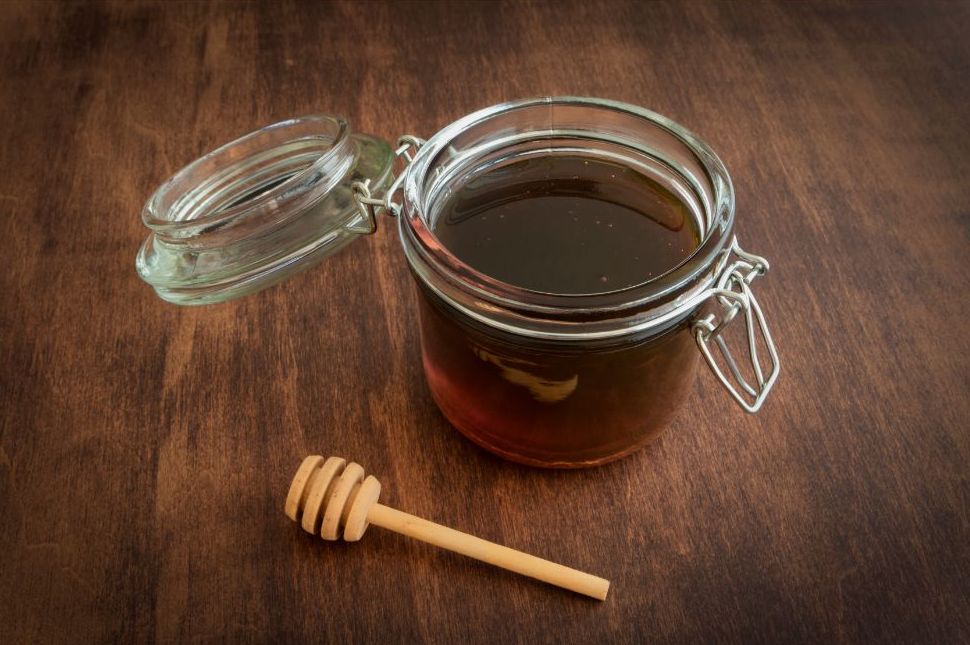 Jar of sorghum syrup stored for use through the winter months