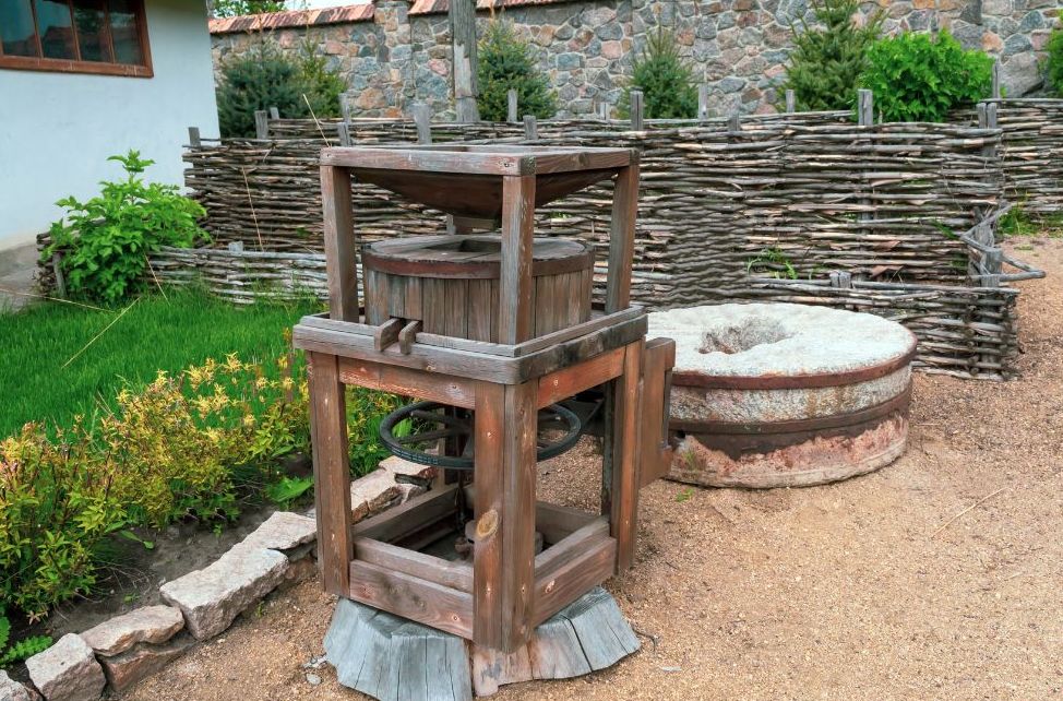 Early wooden hand mill used to grind grain before water-powered mills became common