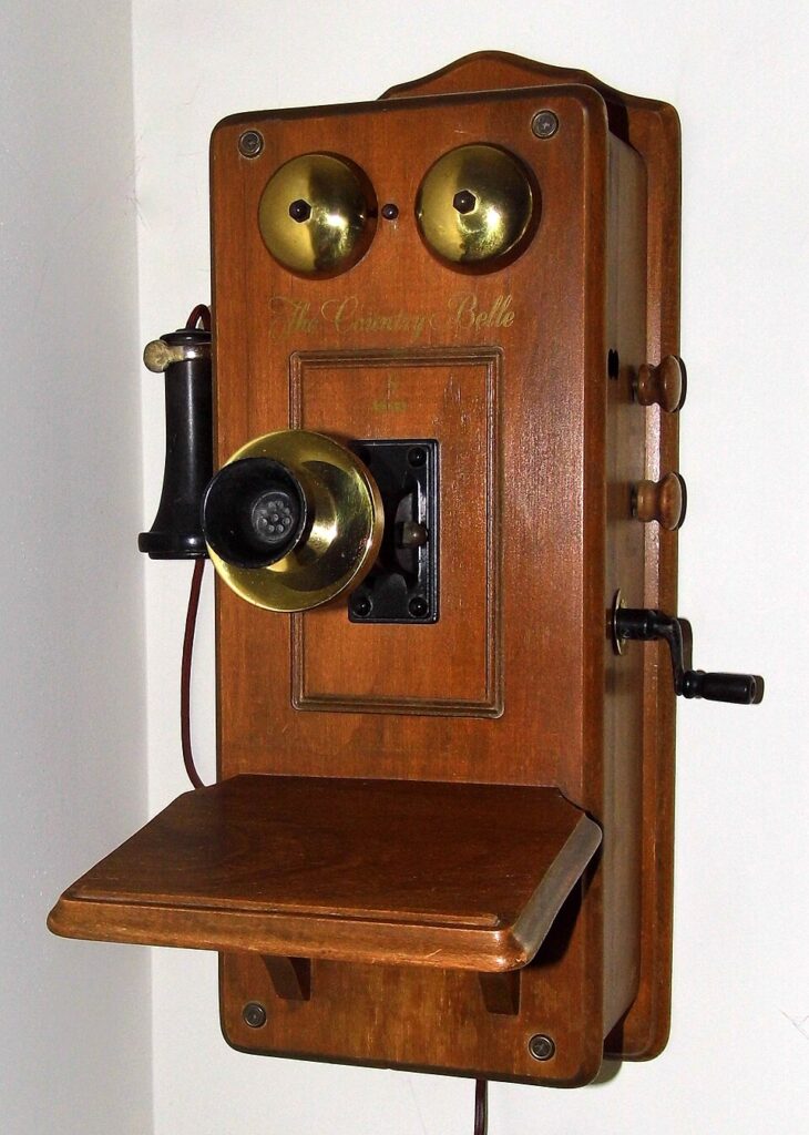 Wall crank telephone used to signal telephone operators in rural homes before direct dialing.