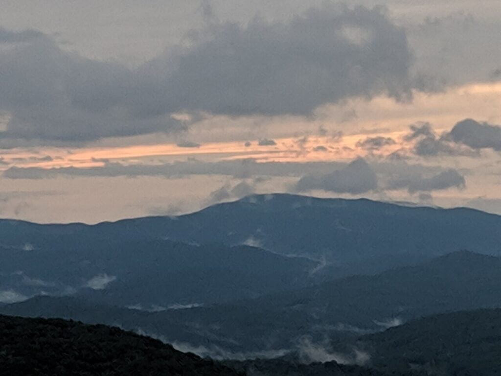 Evening clouds settling over layered mountain ridges in southwest Virginia