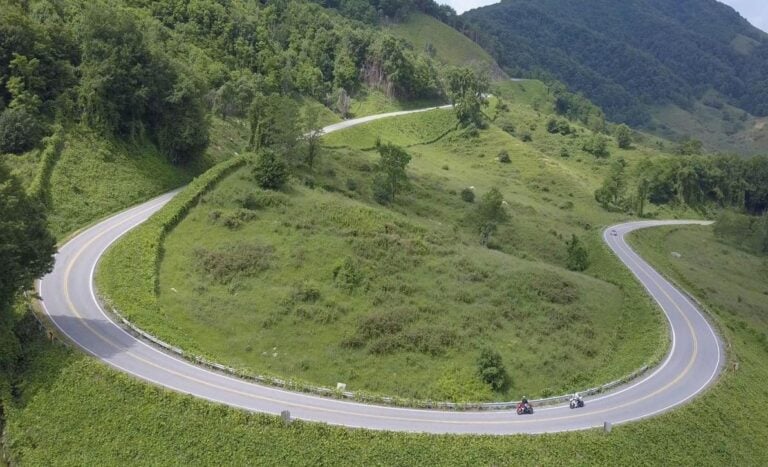 A sweeping series of curves follows the natural contours of the mountains.