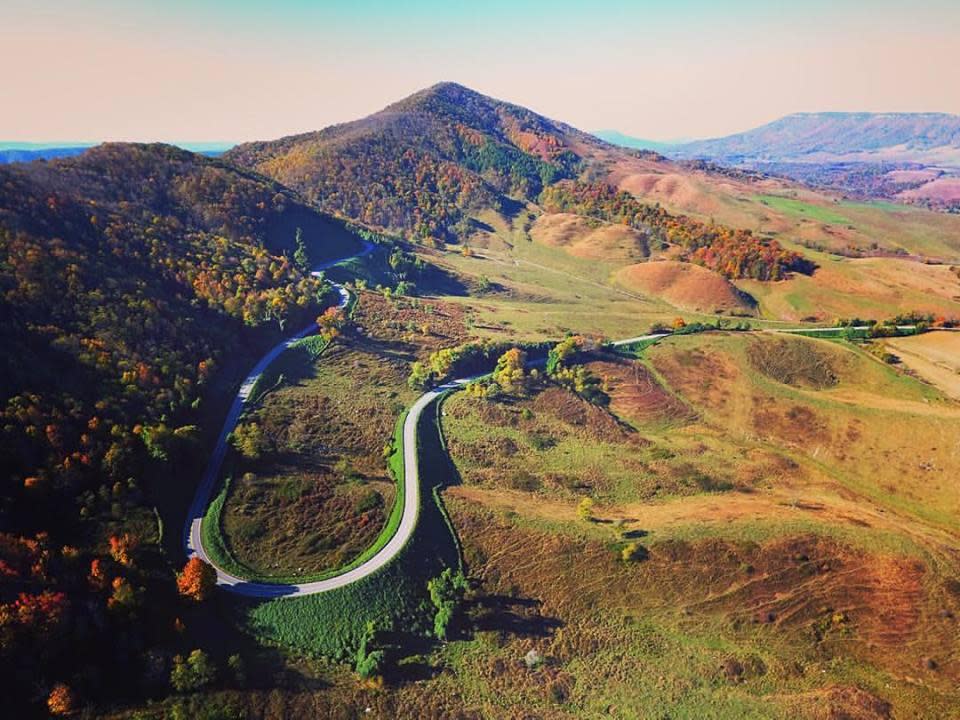 An autumn view shows the road winding through the mountains of Southwest Virginia.