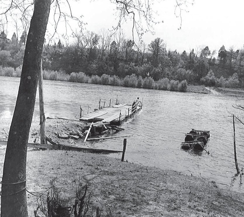 Historic Appalachian ferryman landing at the Old Rome Ferry in Tennessee, showing a simple wooden ferry approach.