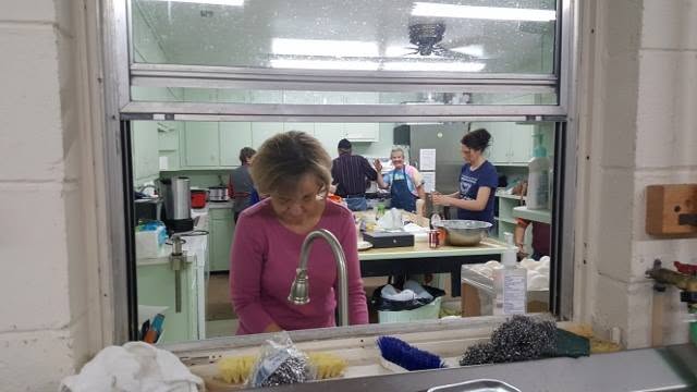 Volunteers work in the kitchen during an Appalachian fundraising meal at Pancake Days in Meadows of Dan.